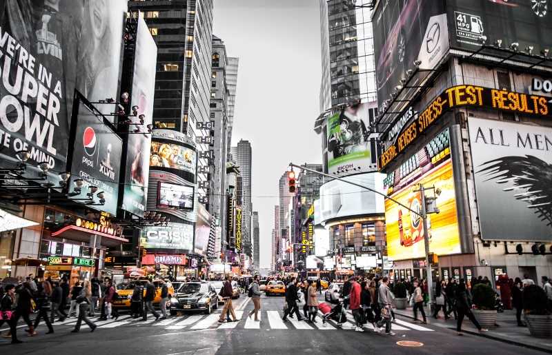 pedestrians crossing a road in a city