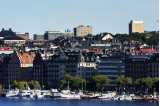 Picture of boats on water with cityscape behind